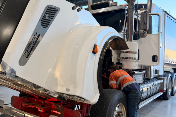 Technician diagnosing a heavy truck