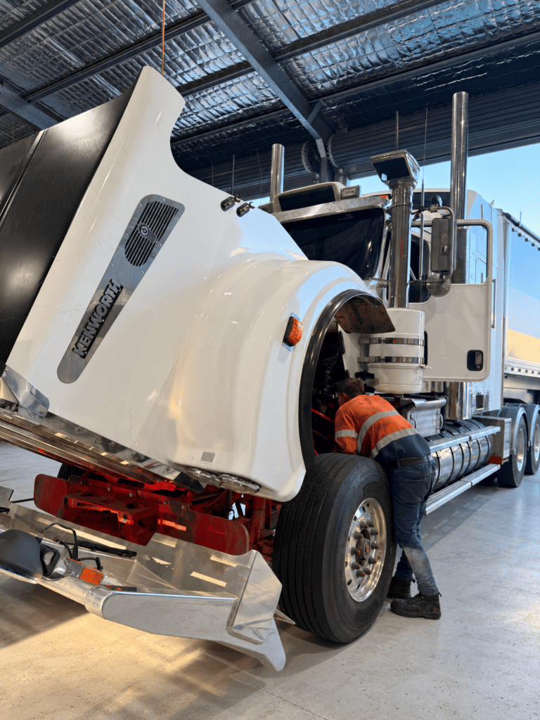 Technician diagnosing a heavy truck